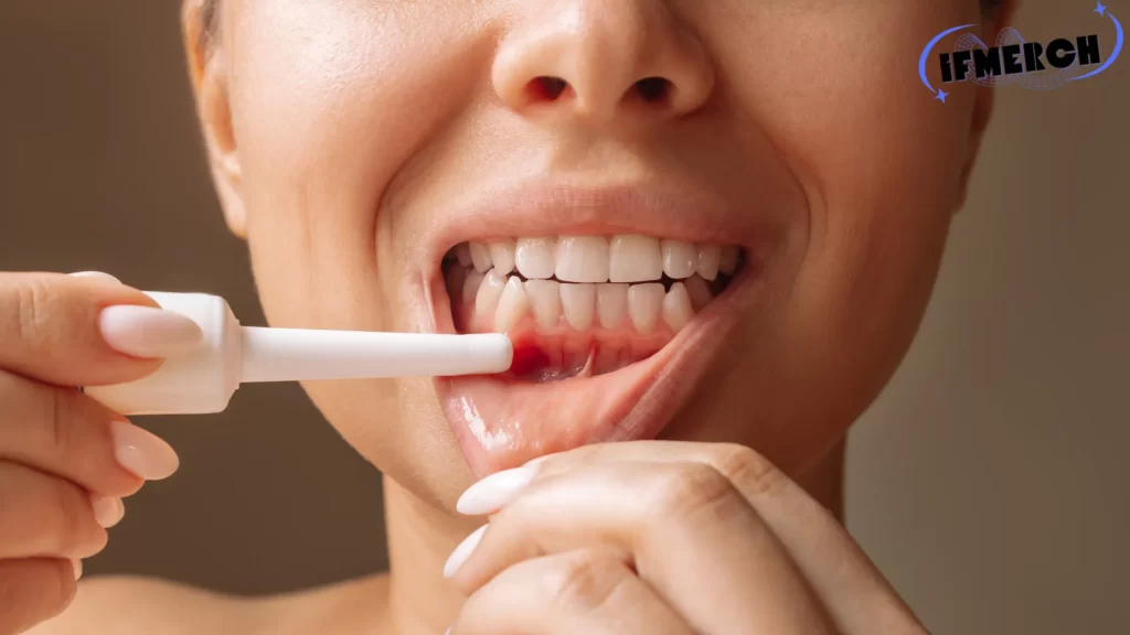 Can gum disease kill you? Close-up of a person applying treatment to inflamed gums, a symptom of gum disease.