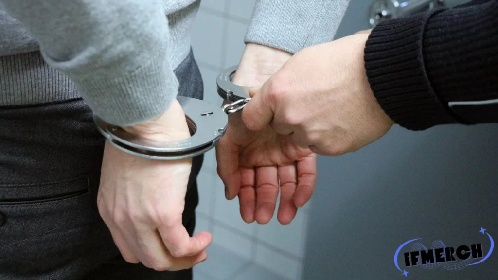 A close-up image of a person being handcuffed, emphasizing the legal consequences of being arrested. The focus is on the question "Can you go to jail at an arraignment?"